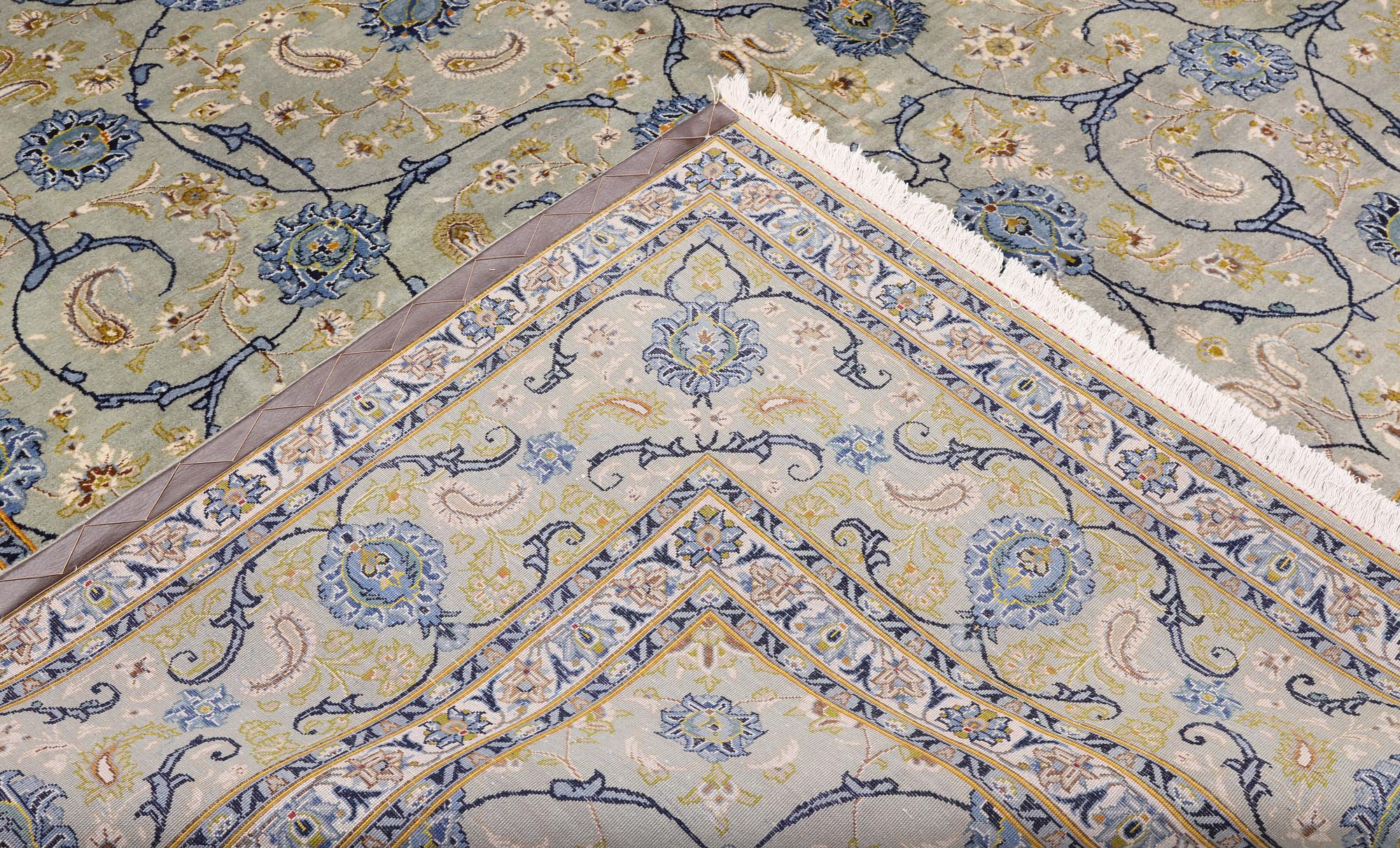 A Royal Keshan carpet, signed, 410 x 307 cm.
