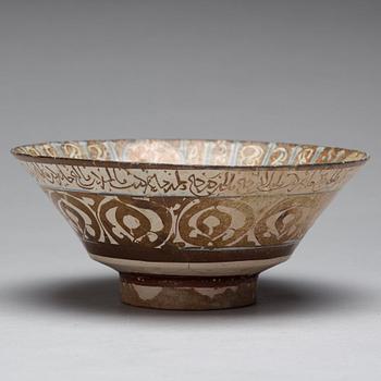 A BOWL, pottery with luster decor and blue, height ca 10 cm, diameter ca 23,5 cm, Kashan style, Persia/Iran 13th.