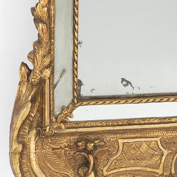 A giltwood rococo mirror, later part of the 18th century.