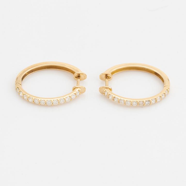 Brilliant cut diamond hoop earrings.