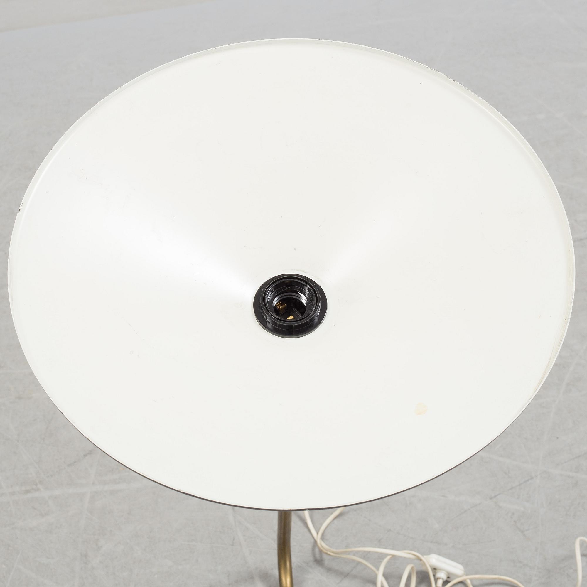 A 20th century brass and painted metal swing-arm wall light.