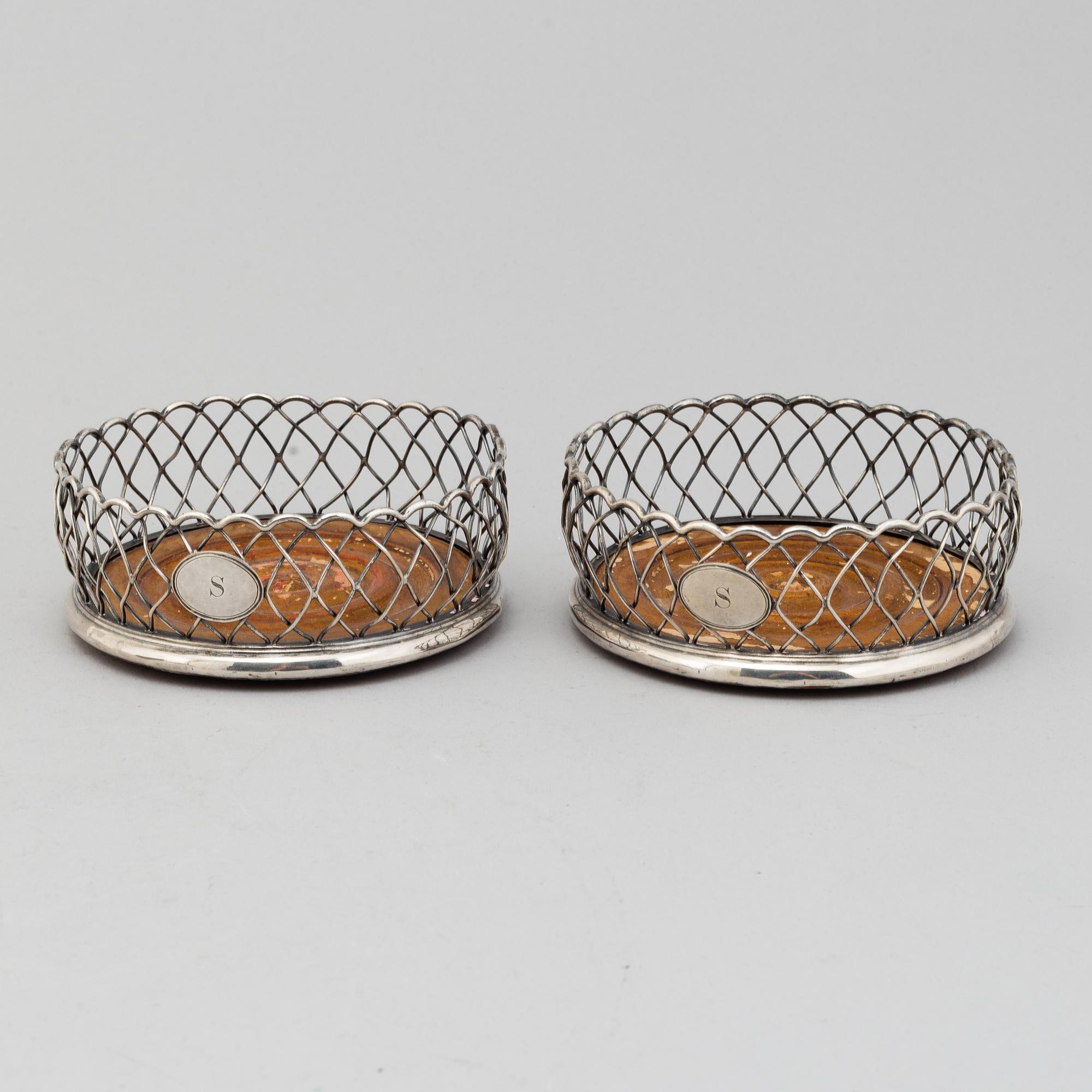 An English pair of 19th century silver plated coasters.