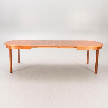 A Nils Jonsson teak and walnut 1960s dining table.