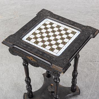 A porcelain and wooden mounted chess table, late 19th century.