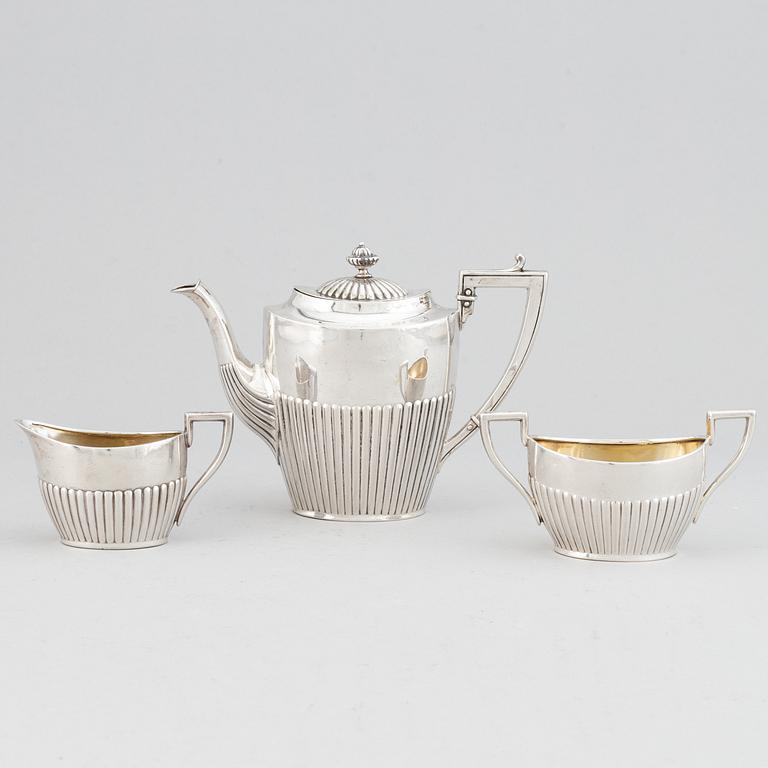 A silver mocha pot, creamer and sugar bowl, swedish import mark of NL Dahlström & Co, Örebro 1930.