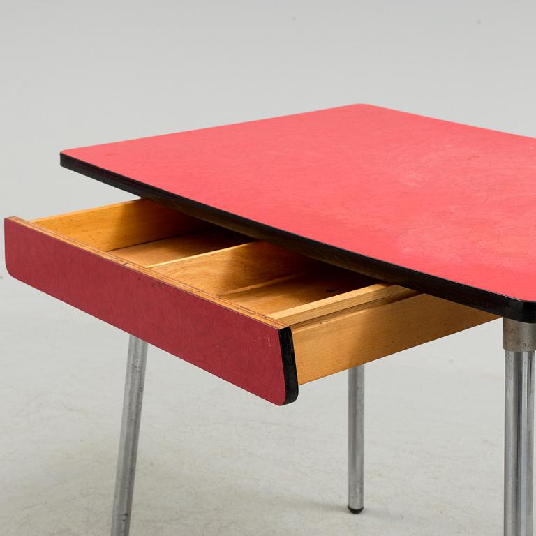 A mid 20th century table and chair.