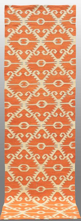 A CARPET flat weave, around 292 x 83 cm.