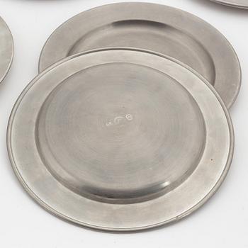 A set of six pewter plates from Firma Svenskt Tenn, including Stockholm 1968.