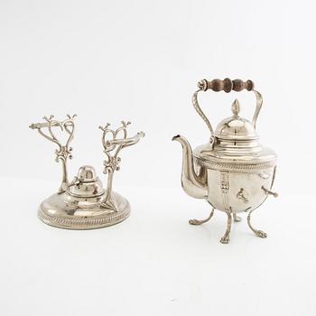 Tea kettle with a burner around 1900.