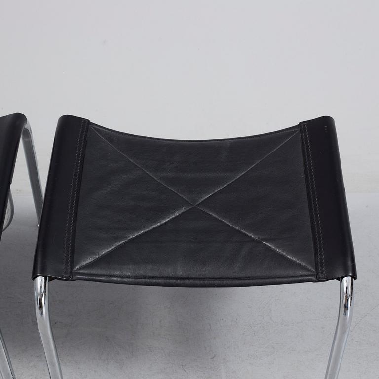 A pair of easy chairs and ottoman, designed by Hans Eichenberger, Strässle, Switzerland.