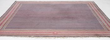 A oriental carpet, signed, c. 295 x 295 cm.
