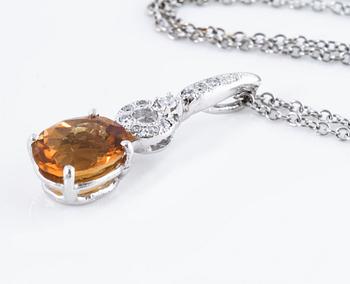 A citrine and brilliant cut diamond pendant.