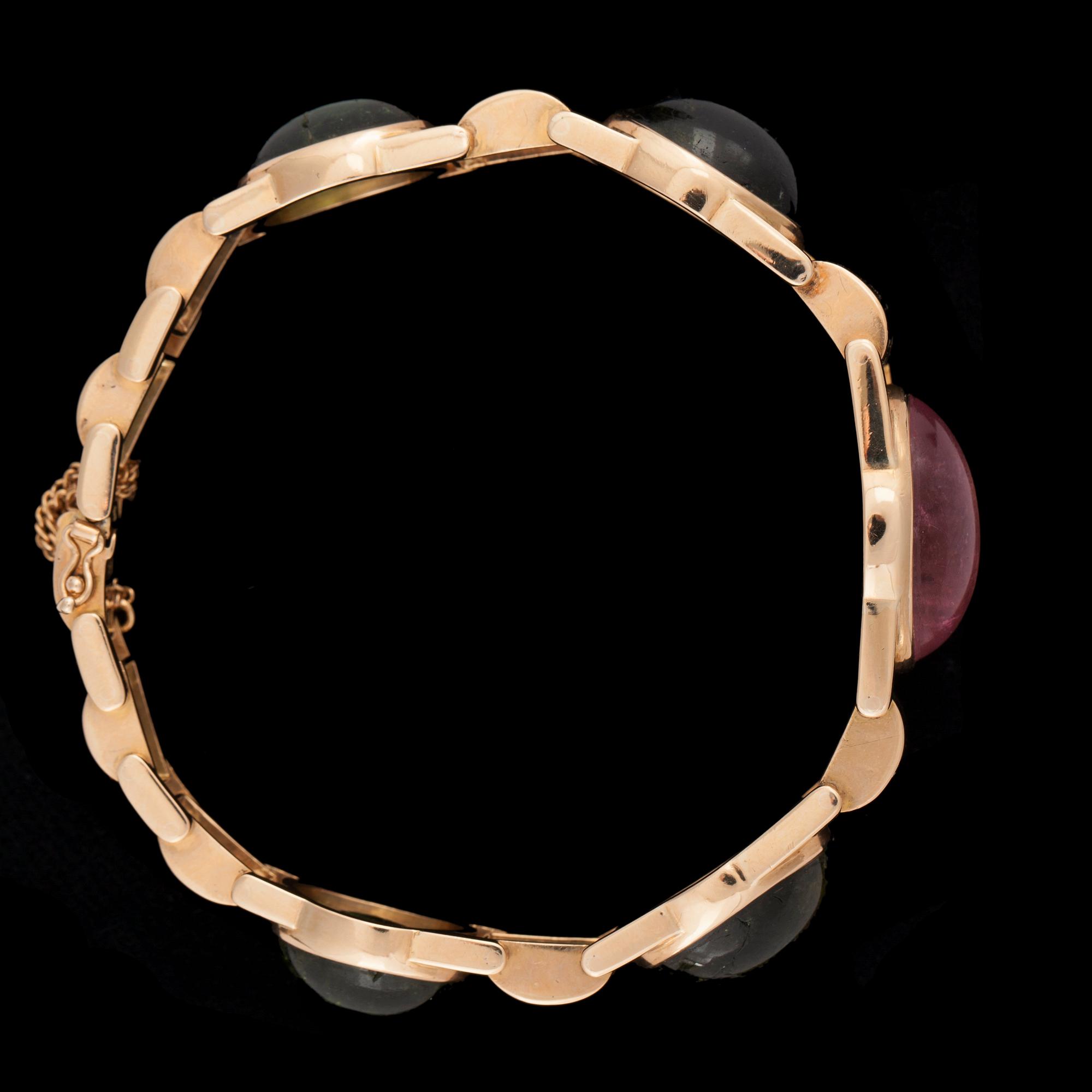 A pink and green tourmaline bracelet.