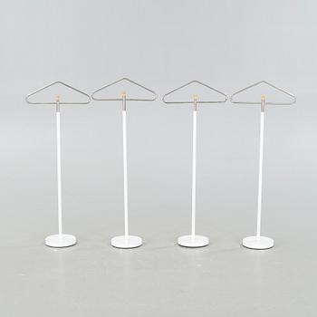 Four late 20th cenutry coat hangers.