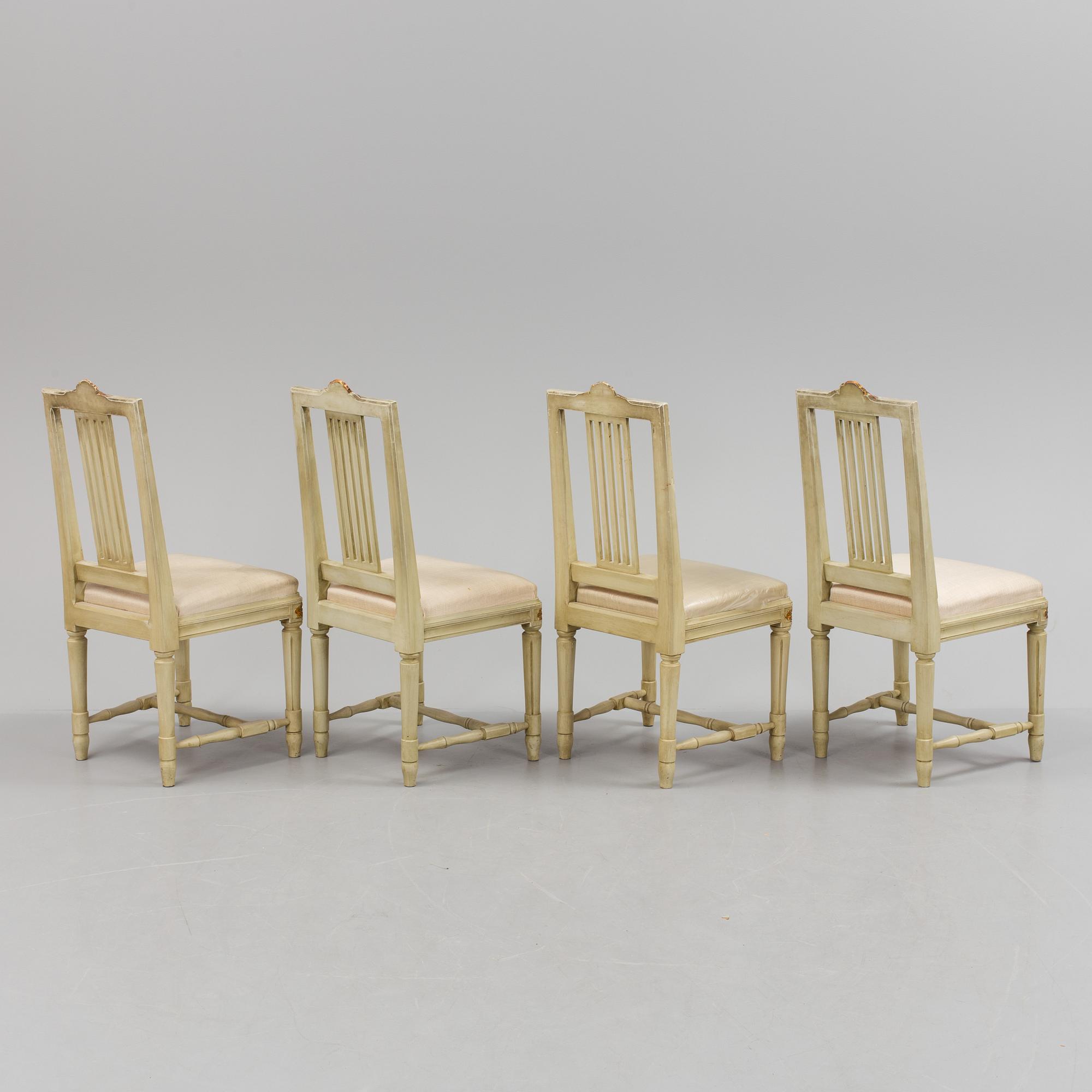 A lot of four mid 20th century Swedish Gustavian style chairs and one dinner table from around year 1900.