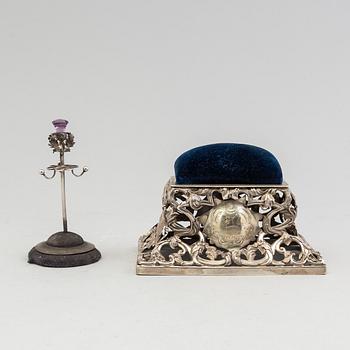 A Swedish 19th century silver pincushion and an English early 20th century pinstand.