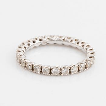 A 14K gold eternity ring set with round brilliant-cut diamonds.