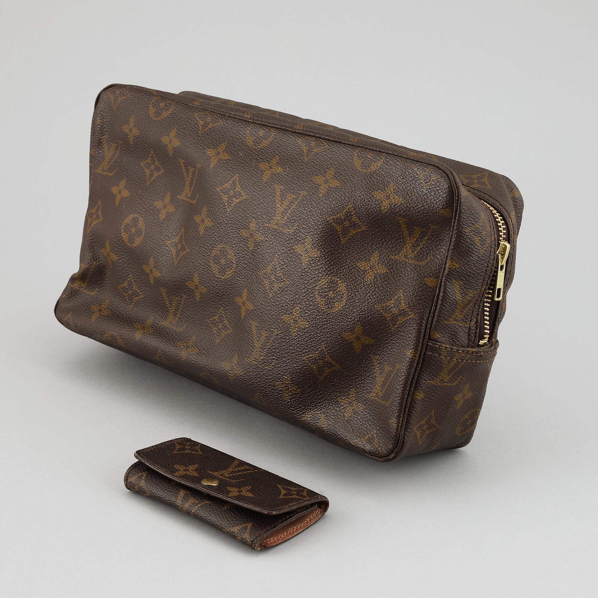 LOUIS VUITTON, a 'Trousse toilette 28' toilet bag and a key case.
