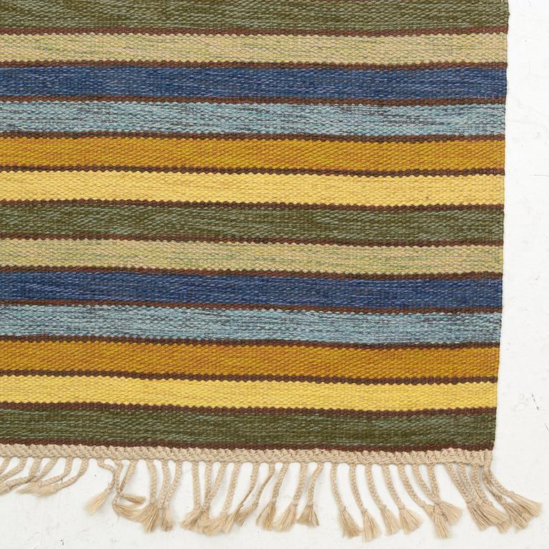 A flat weave runner, c. 580 x 90 cm.