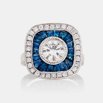 1201. A sapphire and brilliant-cut diamond ring.