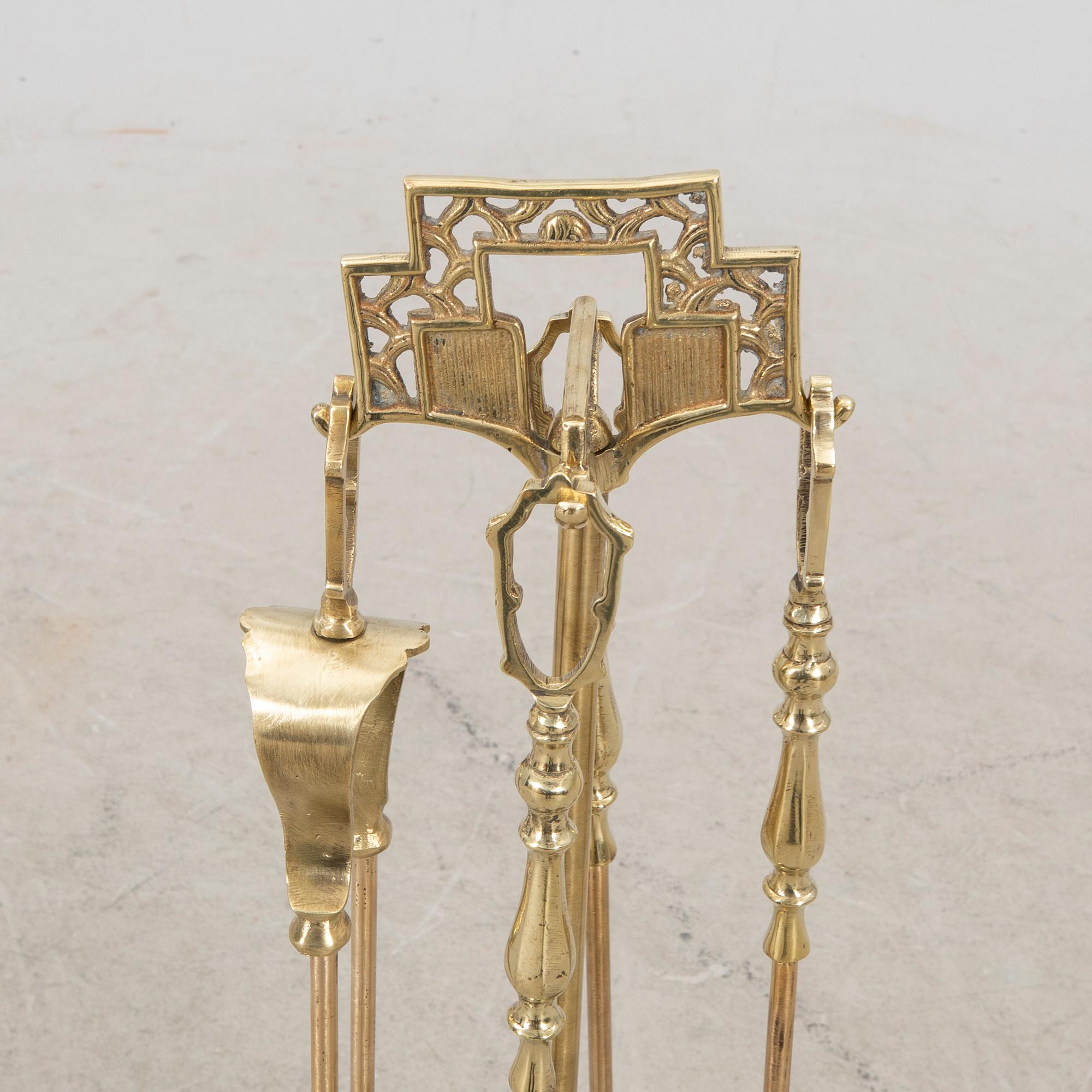 A late 20th century English brass fire tools.