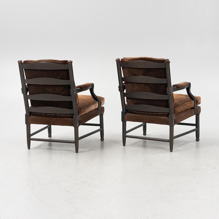 A pair of stained oak Gripsholm model armchair, late 20th Century.