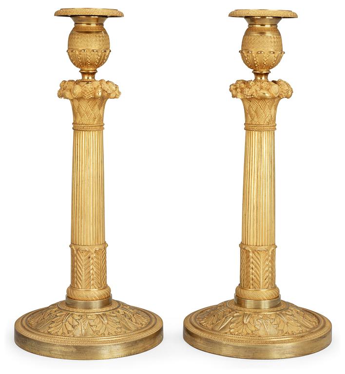 A pair of French Empire early 19th century candlesticks.