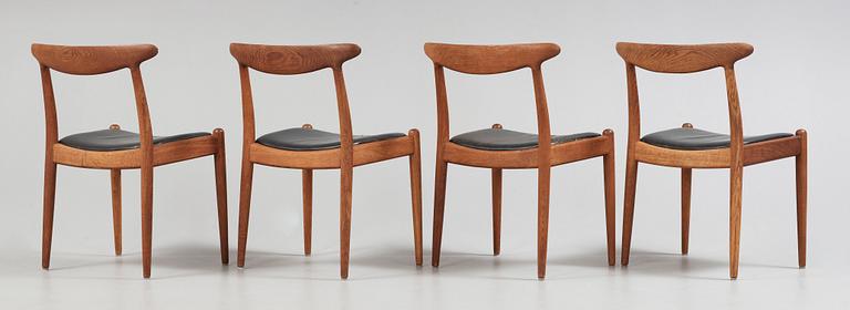 A Hans J Wegner oak dinner table 'AT 312' and four oak and black leather chairs, C M Madsen, Denmark 1950-60's.