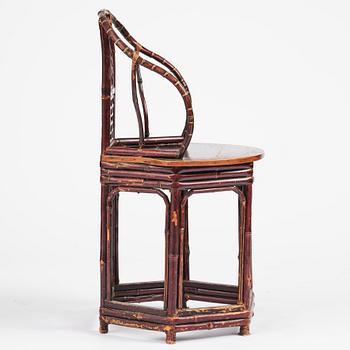A Chinese bamboo horseshoeback armchair, late Qing dynasty.