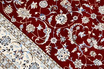 A Nain part silk carpet, 302 x 204 cm.