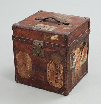 A early 20th cent brown leather trunk by Louis Vuitton.