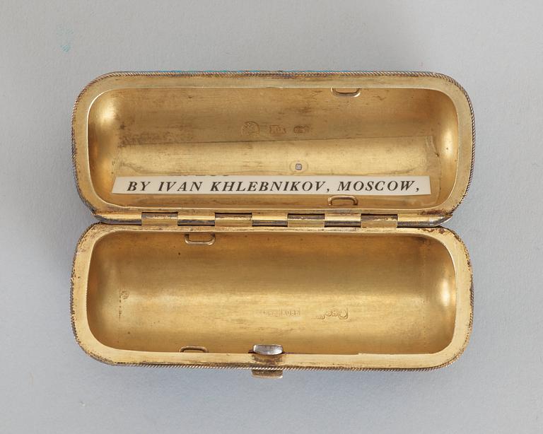A Russian 19th century silver-gilt and enamel cigarette-case, makers mark of Ivan Chlebnikov, Moscow.