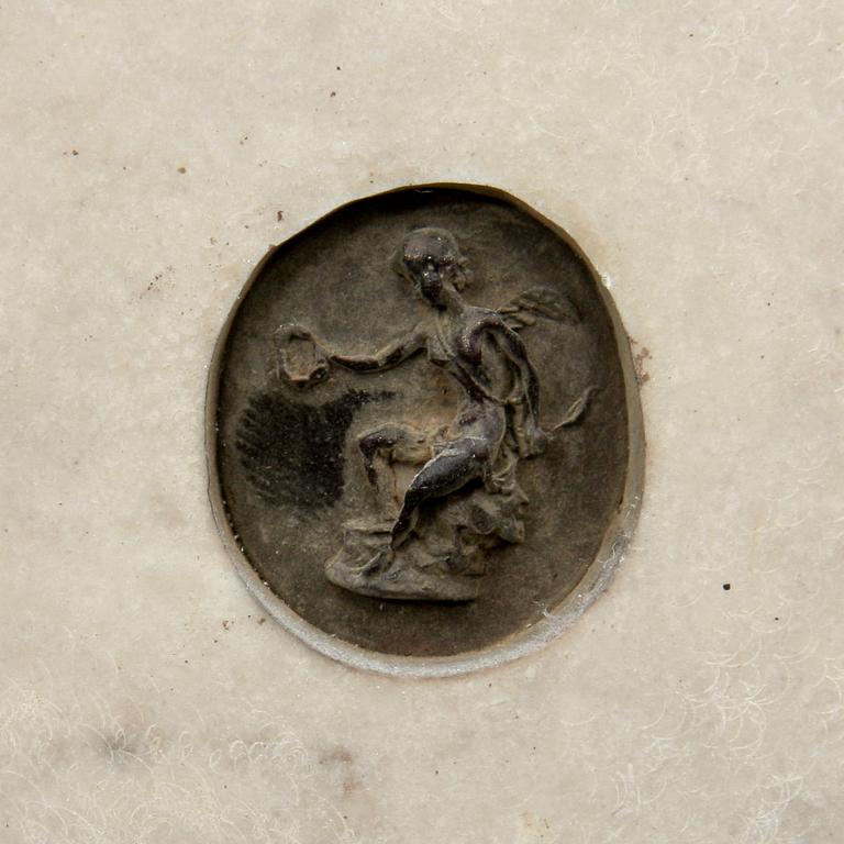 VÄGGRELIEFER, 2 st. Stenmassa, bär otydl påskrift 1878.