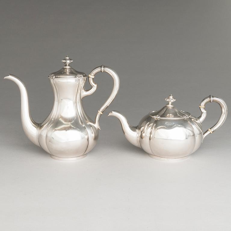 SAZIKOV, A 5-piece silver coffee and tea set, mark of the Sazikov Firm, Imperial Warrant, Saint Petersburg 1860.