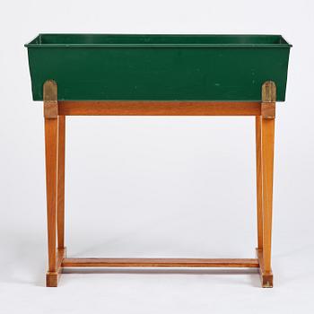 Josef Frank, a rare flower table with green lacquered box model B 2084, Firma Svenskt Tenn, 1950-60s.