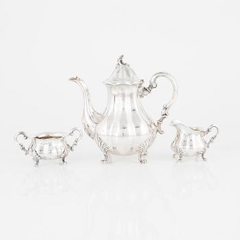 A Rococo-Style Sterling Silver Coffee Pot, Creamer and Sugar Bowl, Swedish import marks.