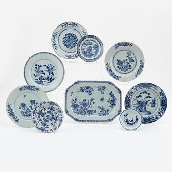 A blue and white serving dish and eight odd plates, Qing dynasty, 18th Century.