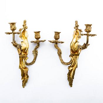 A pair of Rococo style gilded wall scones late 19th century-early 20th century.