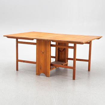 A gate-leg table, around 1900.