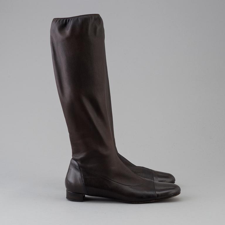 Brown leather boots by Chanel.