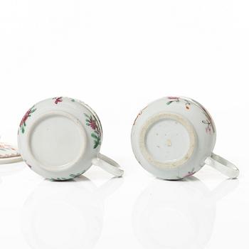 A group of 12 CHinese famille rose porcelain custard cups with covers, Qing dynasty, 18th century.