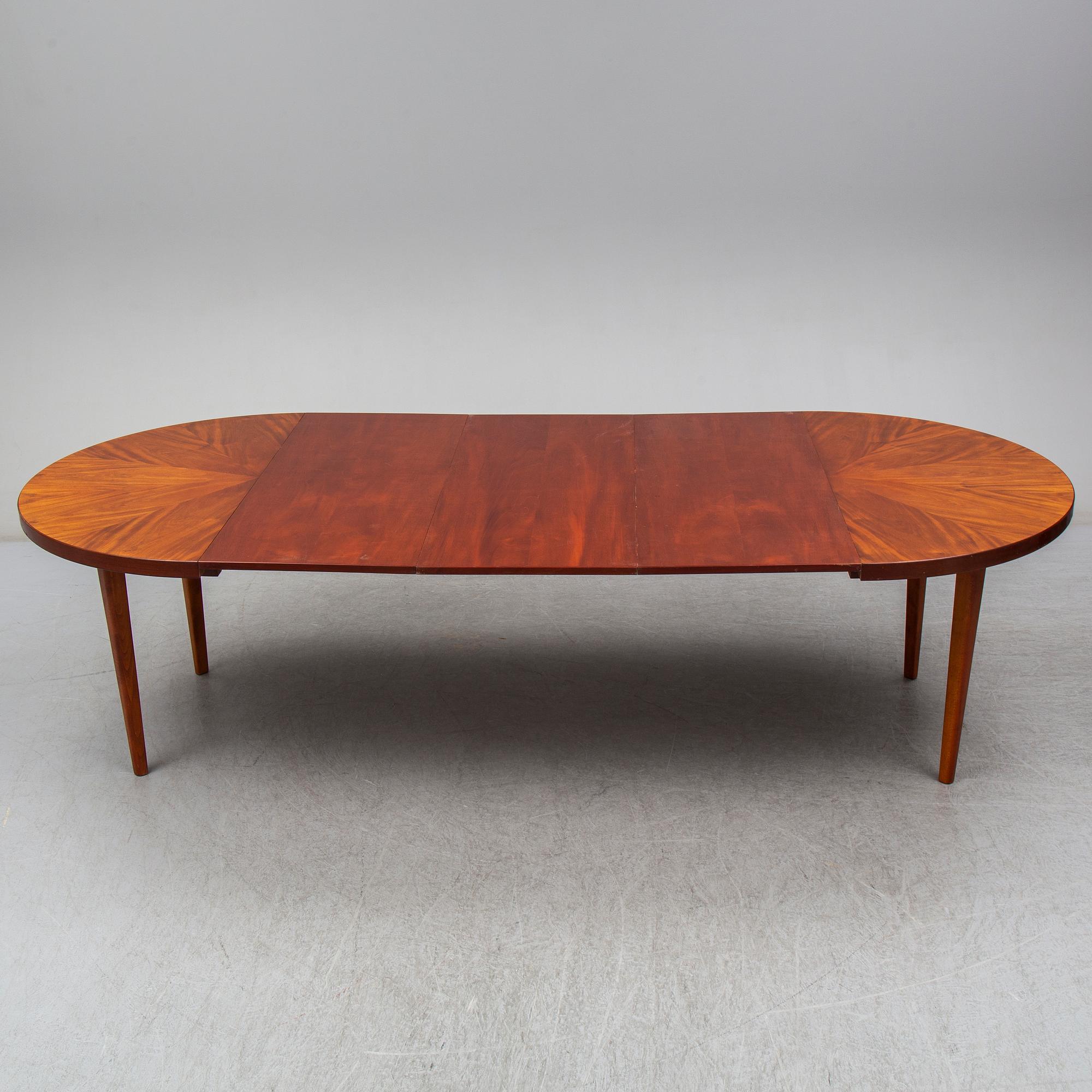 a mahogany dining table from the mid 20th century.