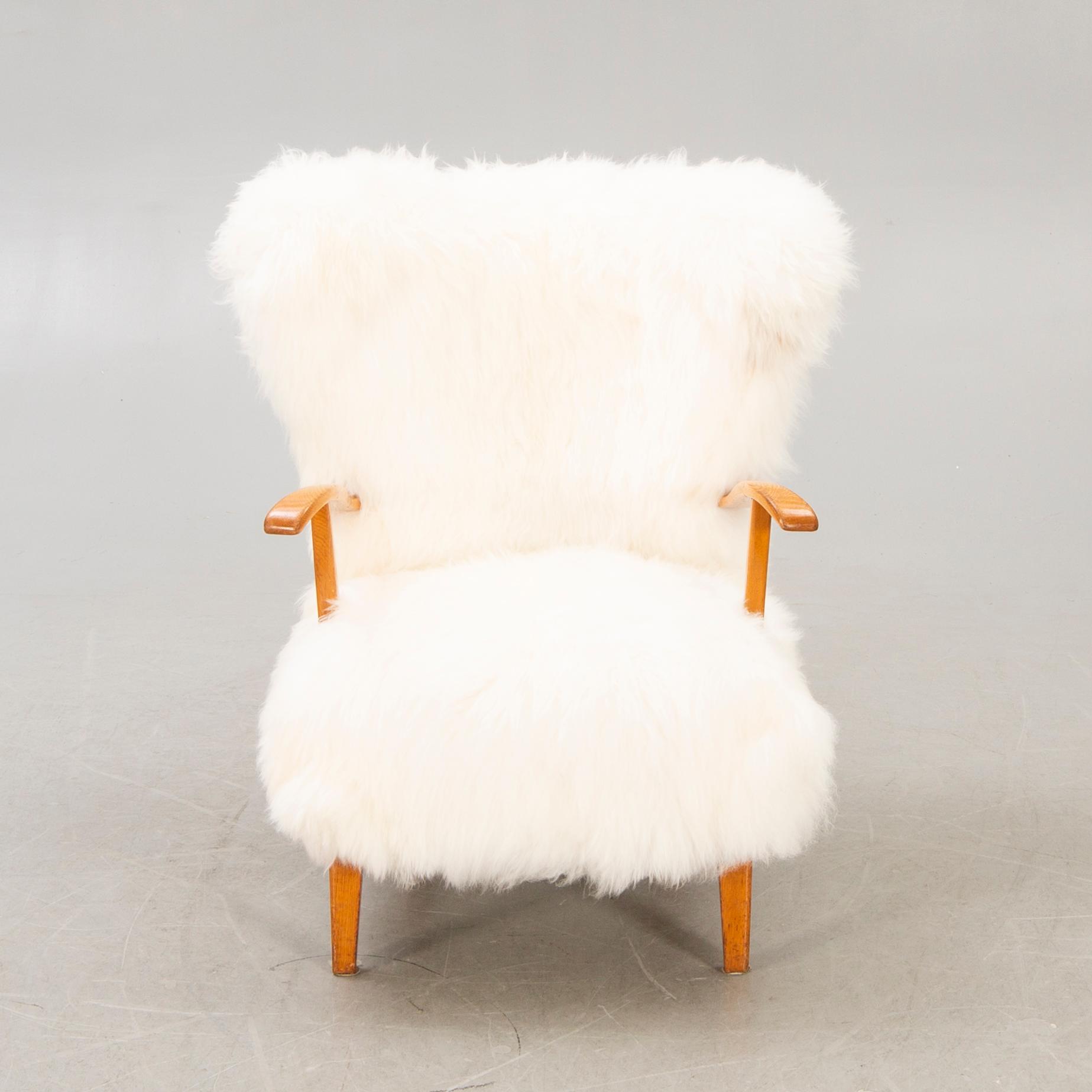 A 1940s sheepskin armchair.