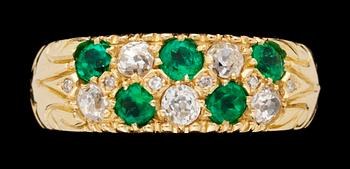 707. An emerald and diamond gold ring.