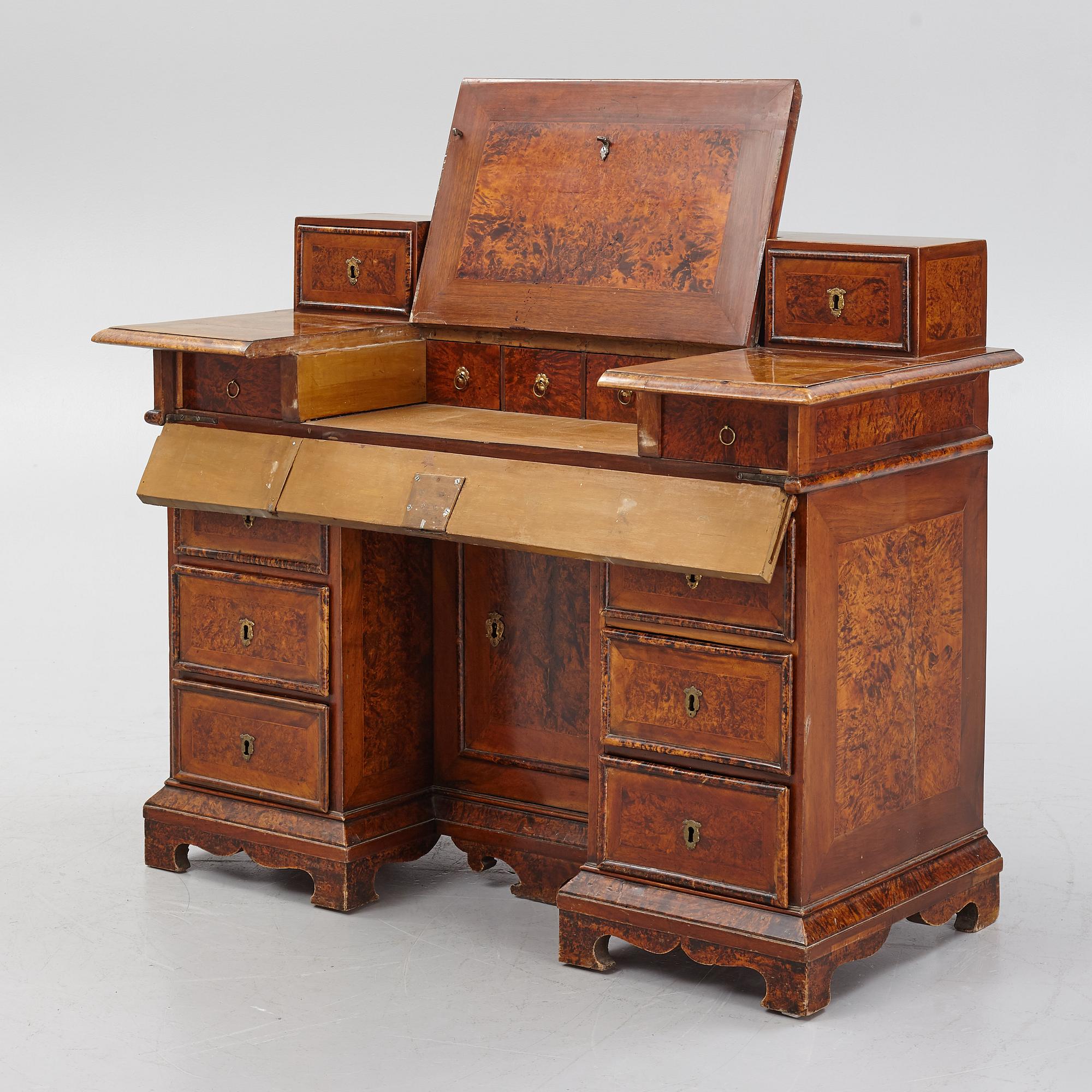 A Swedish late Baroque alder-veneered 'knee-hole' writing desk, first part of the 18th century.