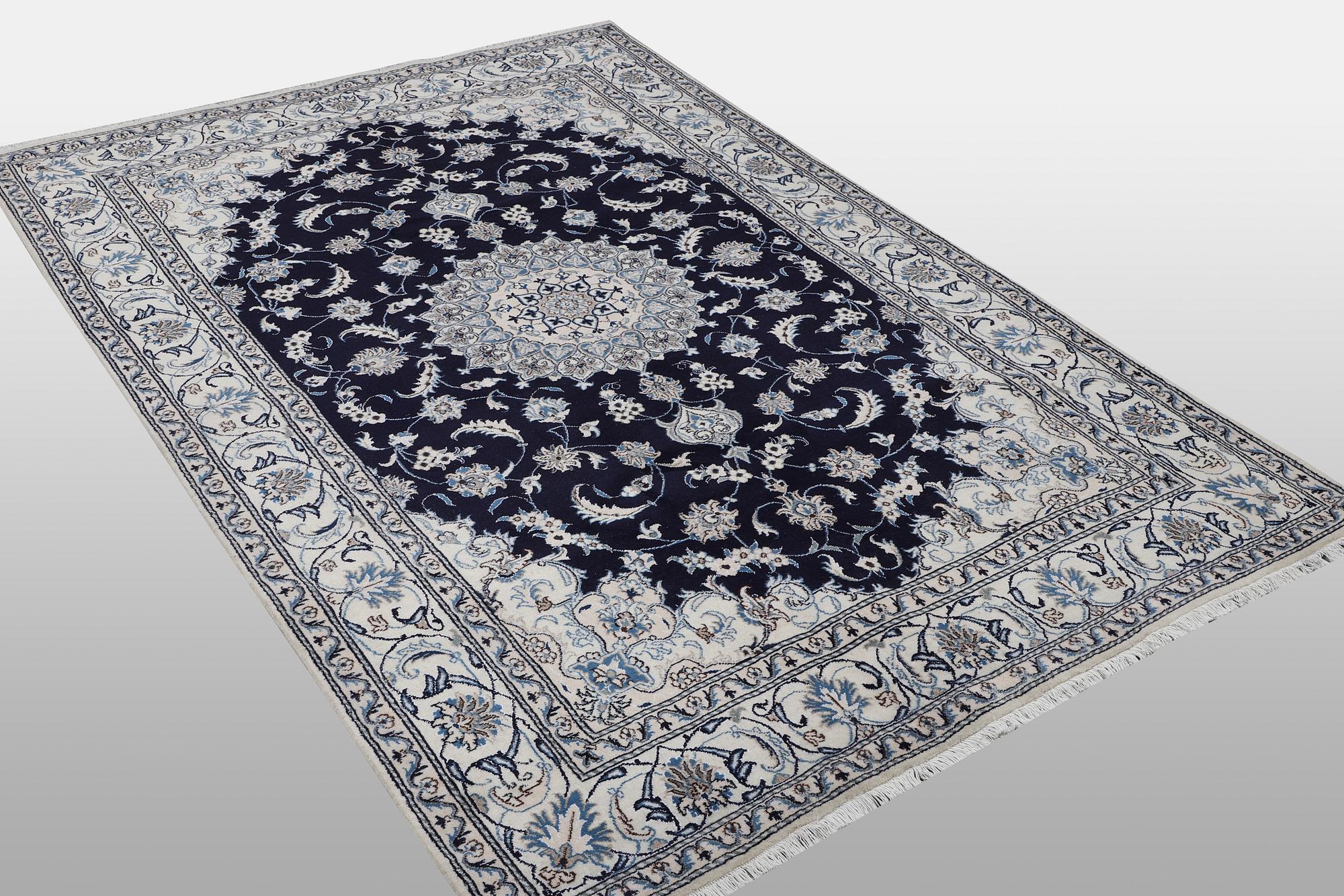 A carpet, Nain, part silk, ca 310 x 205 cm.