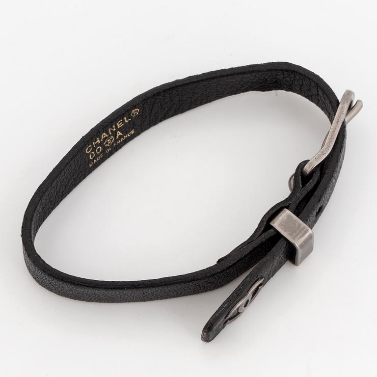 CHANEL, a leather bracelet.