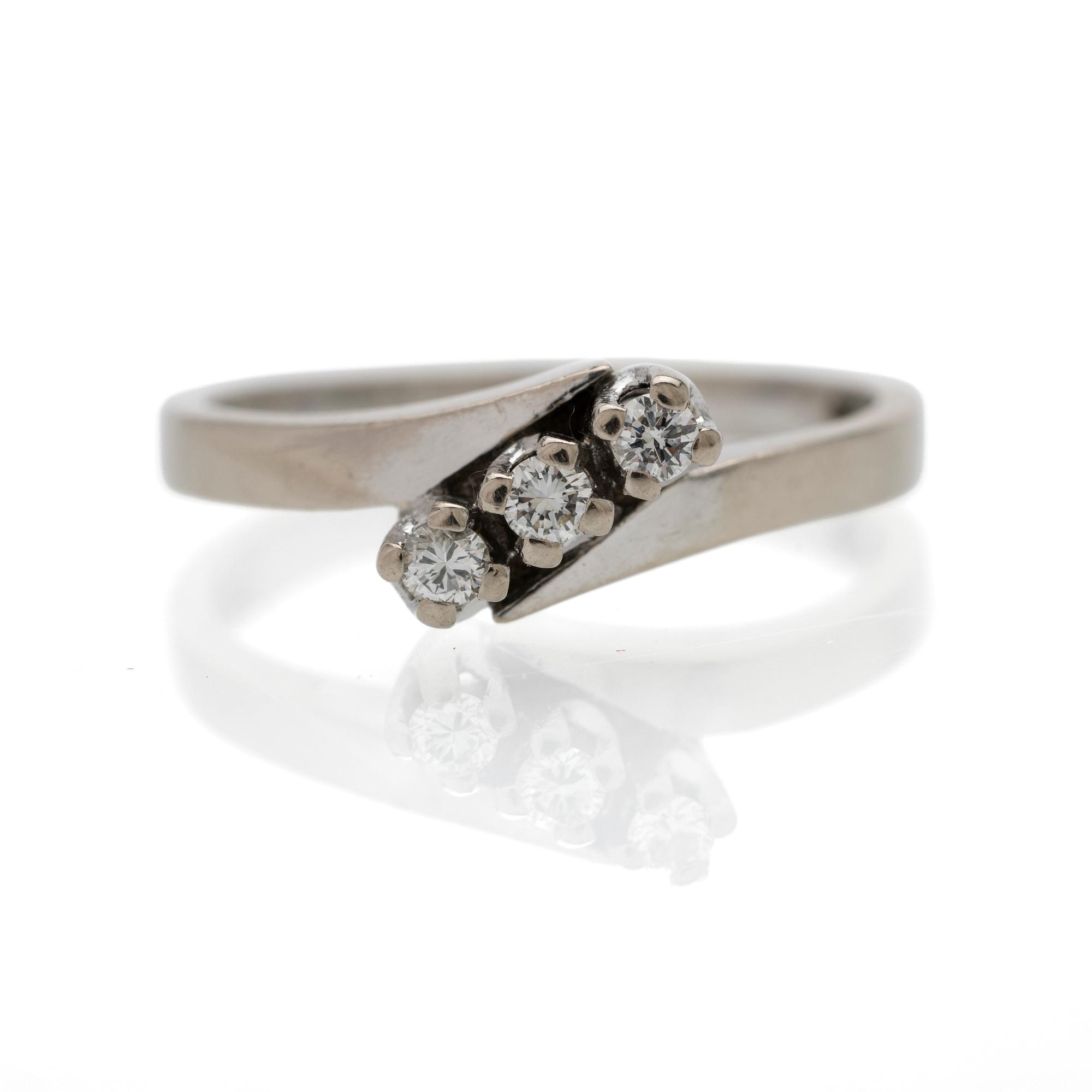 18K white gold ring with diamonds.