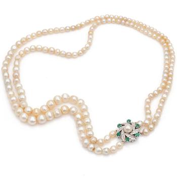 A double strand cultured pearl necklace Clasp set with diamonds and emeralds.