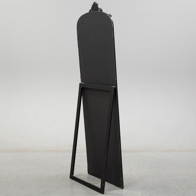 A contemporary floor mirror.